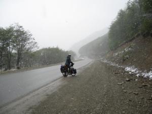 First day of the ride near Ushuaia. Its snowing but Mel's loving it.