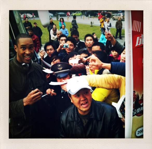 Signing autographs after a game in China