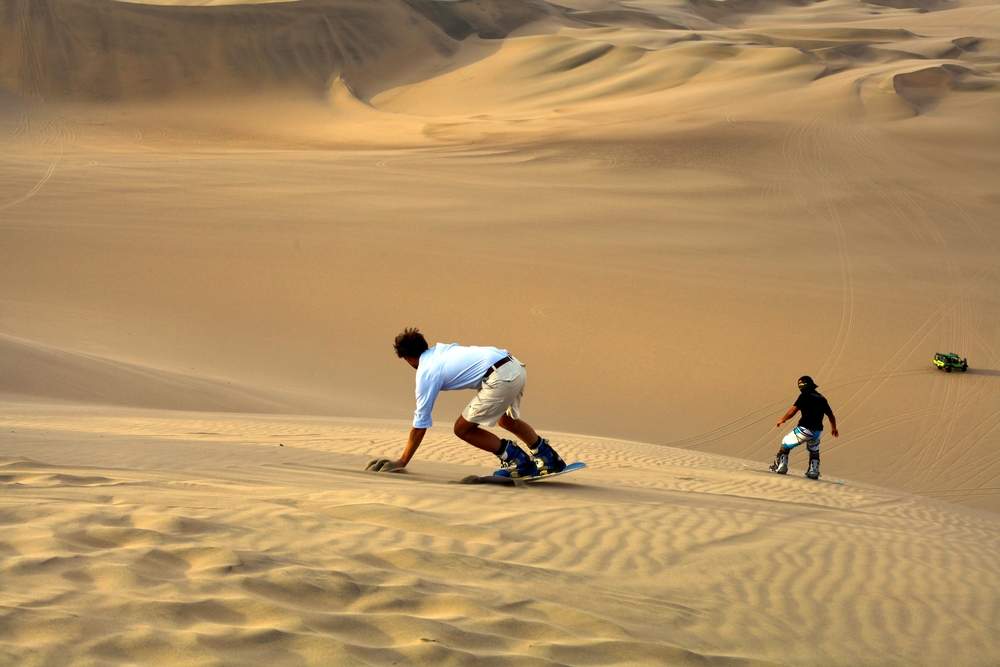 sand board in Peru snowboarding without the cold